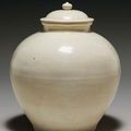 A straw-glazed pottery ovoid jar and cover, Tang dynasty (618-907) 
