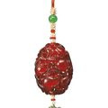 A reticulated amber 'pomegranate' pendant, Qing dynasty, 18th-19th century