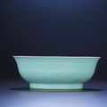 A fine and very rare carved archaistic turquoise-enamelled bowl, Yongzheng six-character mark and of the period