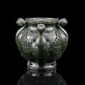 A rare Imperial spinach jade 'phoenix' jar, Qianlong seal mark and of the period