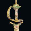 An elegant gemset and enamelled gold sword (khanda) hilt, Mughal India, 18th century