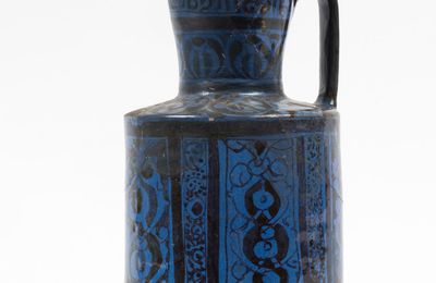 A rare Kashan blue lustre pottery ewer, Persia, 12th-13th Century