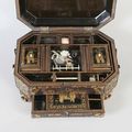 A 19th century Chinese lacquered work box of canted rectangular outline