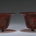 A pair of red Peking glass bowls with carved decoration, Qianlong marks, Late Qing-Republic period