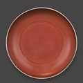 A copper red glazed dish, Qianlong six-character mark and of the period