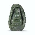 A spinach-green jade Buddha within a grotto, Qing dynasty, Qianlong period