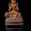 A gilt-lacquered and painted bronze figure of Manjushri, Ming dynasty, circa 16th century