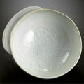 A rare 'qingbai' 'Peony' handled cup, Song dynasty (960-1127)