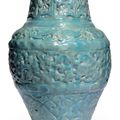 A turquoise glazed moulded pottery jar, Seljuk Iran, 12th or early 13th century