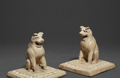 A pair of green-glazed seated lions, 6th - 7th century