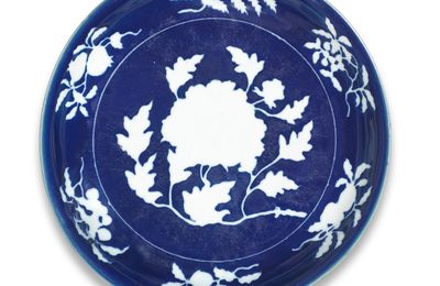An exceptionally rare and large blue and white reserve-decorated 'peony' dish, Xuande six-character mark in a line and of the pe