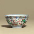 A wucai 'Dragon and Phoenix' bowl, Kangxi six-character mark in underglaze blue within a double circle and of the period