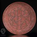 An important Imperial carved red lacquer dish, China, Jiajing six-character-mark and of the period