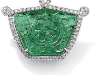 A carved emerald and diamond brooch/pendant