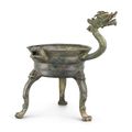 An inscribed archaic bronze ritual lamp, jiaodou, Six Dynasties period (317-587)