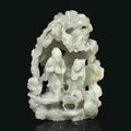 A finely carved pale greenish-white jade grotto group, 17th-18th century
