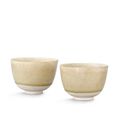 A pair of transparent-glazed whiteware cups, Sui-Tang dynasty
