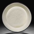 A small carved Dingyao dish, Northern Song dynasty, 11th-12th century