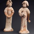 A pair of painted red pottery figures of court ladies, Tang dynasty (AD 618-907)