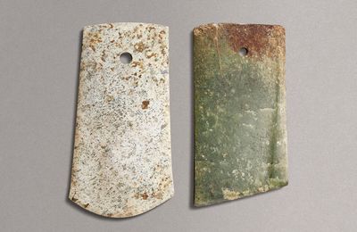 A mottled celadon jade adze and a mottled green jade axe, Neolithic period (circa 6500-1700 BC)