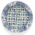 An Iznik polychrome pottery dish with stylised cloud and cintamani design, Turkey, circa 1580-85