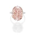 Magnificent platinum, fancy intense orangy pink diamond and diamond ring