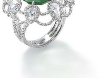 An emerald and diamond ring. 