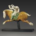 A very rare and important sancai-glazed pottery figure of a female polo player, Tang dynasty (AD 618-907)