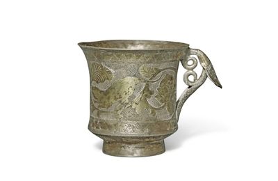 A foliate-handled parcel-gilt 'floral' silver cup, Tang dynasty