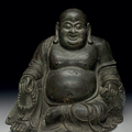 A rare large dated bronze figure of seated Budai, Ming dynasty, dated by inscription to the third year of the Xuande period
