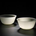 An exceptional pair of Imperial white jade bowls, Incised Qianlong four-character marks and of the period