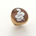 A gold ring by Pomellato with snake on came