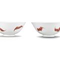 A rare pair of copper-red-decorated 'five bats' bowls, Yongzheng six-character marks and of the period (1723-1735)