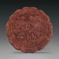 A finely carved cinnabar lacquer octafoil box and cover, Qianlong period (1736-1795)