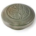 A carved and incised Yue circular box and cover, Early Northern Song dynasty, 10th-11th century