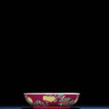 A rare and exquisitely enamelled ruby-ground 'chrysanthemum' dish, Yongzheng four-character mark and of the period (1723-1735)