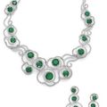 An emerald and diamond necklace and earring suite. 