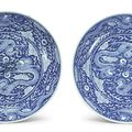 A pair of rare and large blue and white 'Dragon' dishes, Kangxi marks and period (1662-1722)