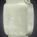 A large pale greenish-white jade archaistic vase, 18th century