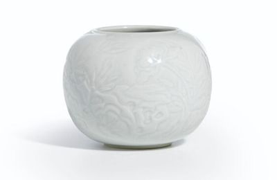 A pale celadon-glazed carved waterpot, Qing dynasty, Kangxi period (1662-1722)