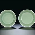 A pair of celadon-glazed dishes, seal marks and period of Qianlong (1736-1795)