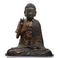 A rare and unusual lacquered bronze seated figure of Buddha