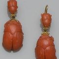 A pair of carved coral scarab earpendants