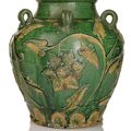 A rare porcelain wine jar with green Fahua-type decoration of lotos and leaves, China, Ming dynasty, 15th/16th ct