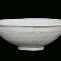 A white engraved earthenware Qingbai bowl decorated with petals, China, Song Dynasty (960-1279)