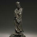A cast bronze standing figure of an immortal, Ming dynasty, 16th-17th century