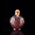 A carved purple glass snuff bottle. mid Qing dynasty