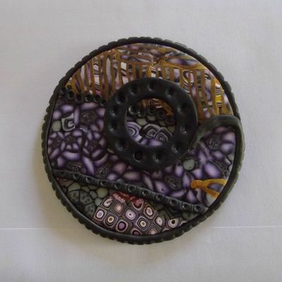 Un sac à main pour un bouton en fimo