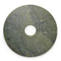 An elegant semi-translucent olive-green nephrite jade Disc, bi, Western Han dynasty (202 BC–9 AD)