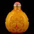 A large finely carved yellow glass snuff bottle. Attributed to Beijing, Qianlong